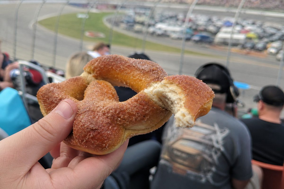 Partially eaten cinnamon sugar pretzel in the stands